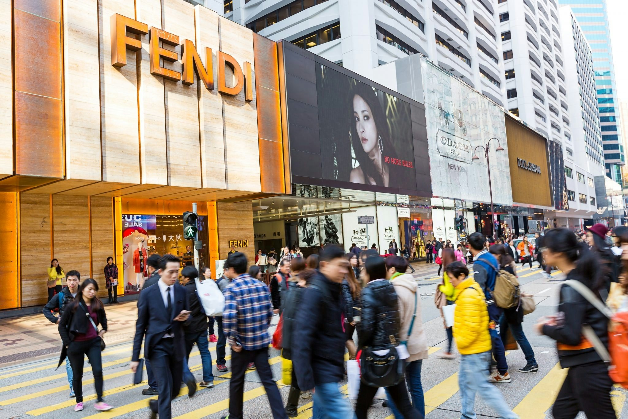 Pedestrians at Canton Road, a luxury brand shopping street in Hong Kong where Hermes, Louis Vuitton, Chanel, Fendi and Coach have flagship stores. Photo: Shutterstock
