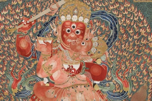 A detailed close-up of part of a Tibetan thangka painting 