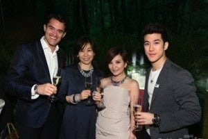 Partygoers celebrate amidst champagne and crystal (Fashion Trend Digest)