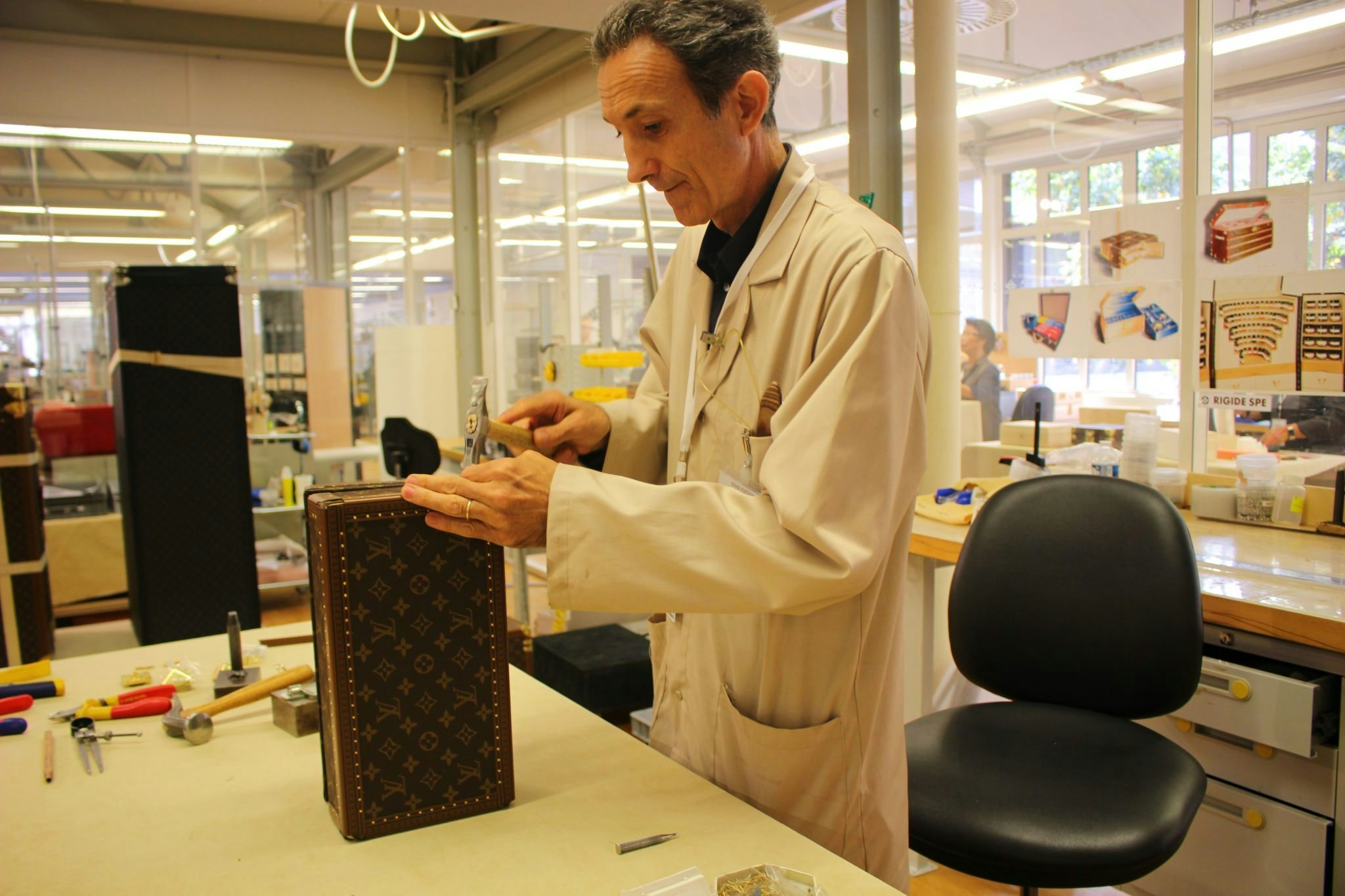 Craftsman in the Louis Vuitton trunk-making atelier. Photo: Lin Wang