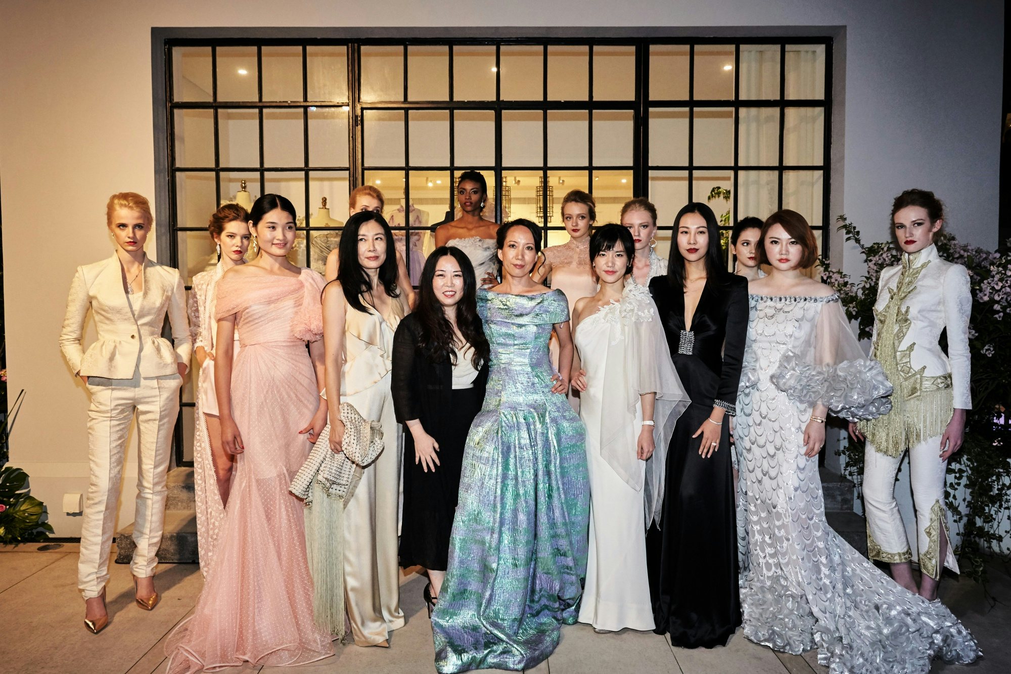 Grace Chen with models wearing her designs at the opening party of The House of Grace Chen in Shanghai. (Seth Powers)