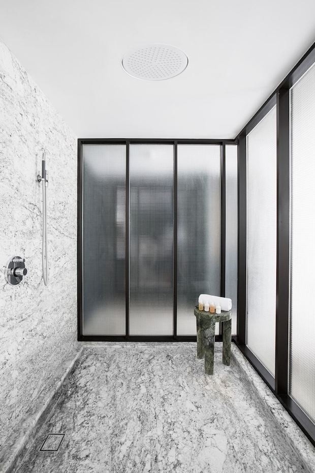 A bathroom featuring black and white marble. (Courtesy Photo)
