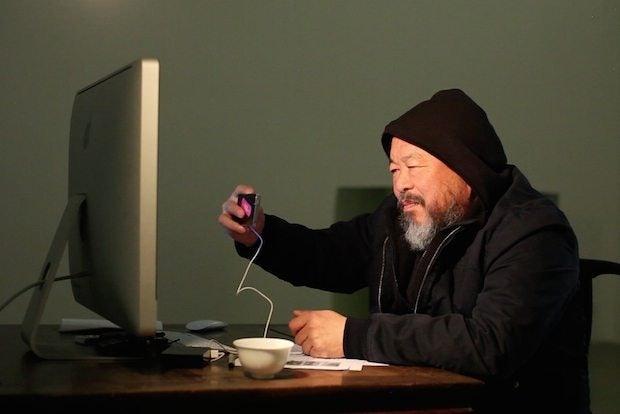 Ai Weiwei directs a scene in Berlin remotely from his desk in Beijing for his new short film in Berlin, I Love You. (Ai Weiwei Studio)