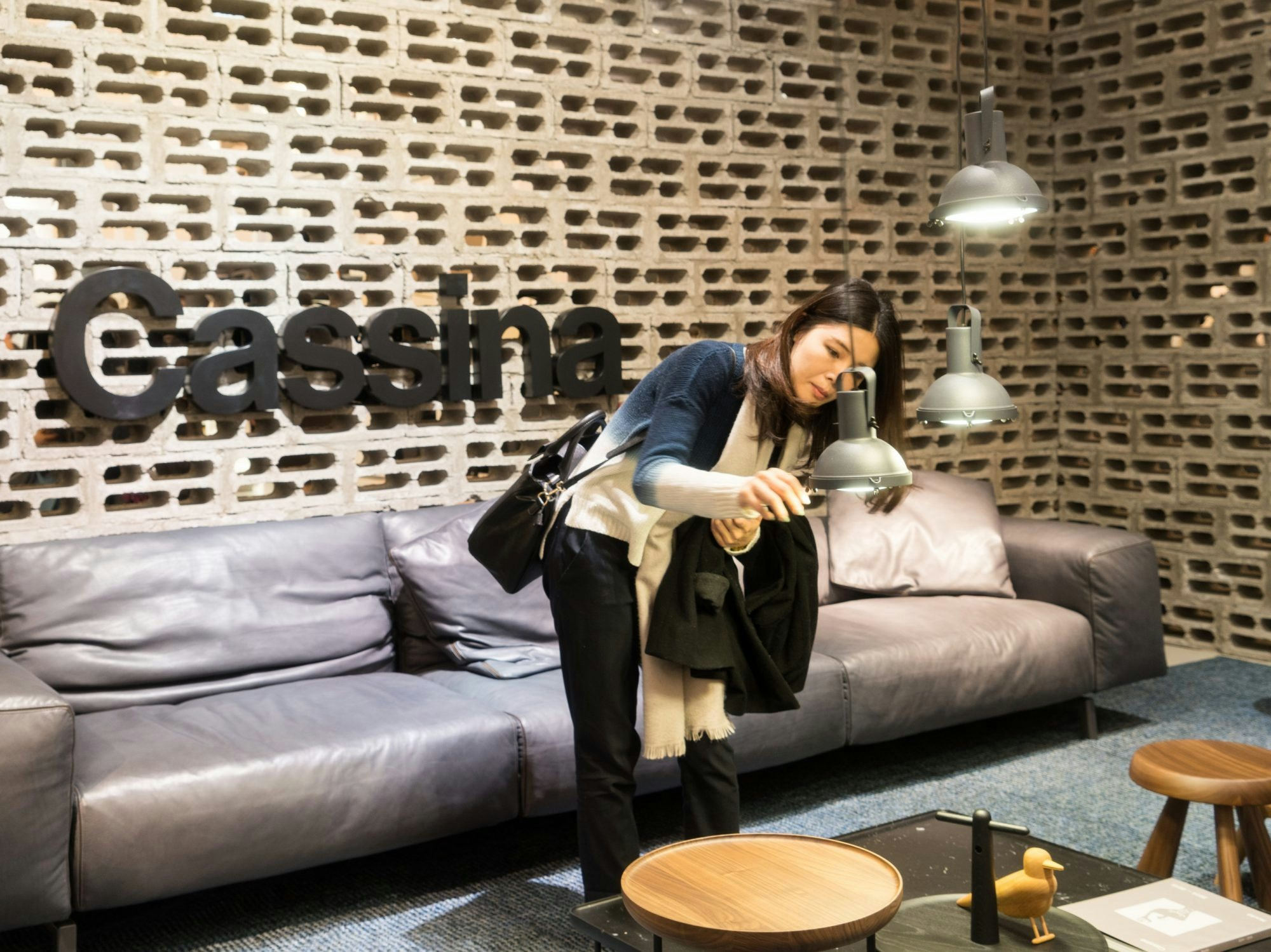 A guest inspects furniture in a display at Design Shanghai 2016. (Courtesy Photo)