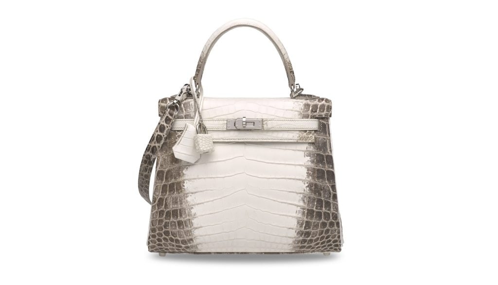 A rare, matte white Himalaya Niloticus Crocodile Retourne Kelly 25 with Palladium Hardware Hermès sold at Christie's Hong Kong holds the world record for handbags. Photo: Christie's