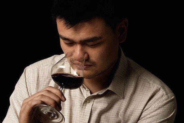 Yao Ming samples a wine from his vineyard. (Courtesy Photo)