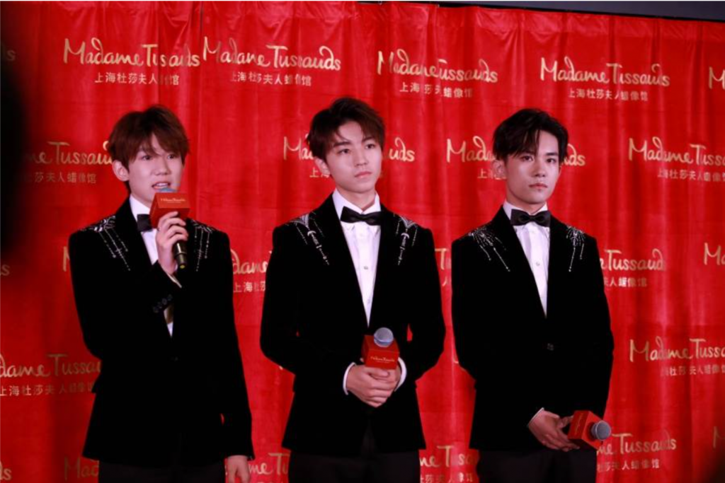 Roy Wang or Wang Yuan, Karry Wang or Wang Junkai, and Jackson Yee or Yi Yangqianxi of Chinese boy group TFBoys at an unveiling ceremony in Shanghai, 2018 [Photo: AFP]