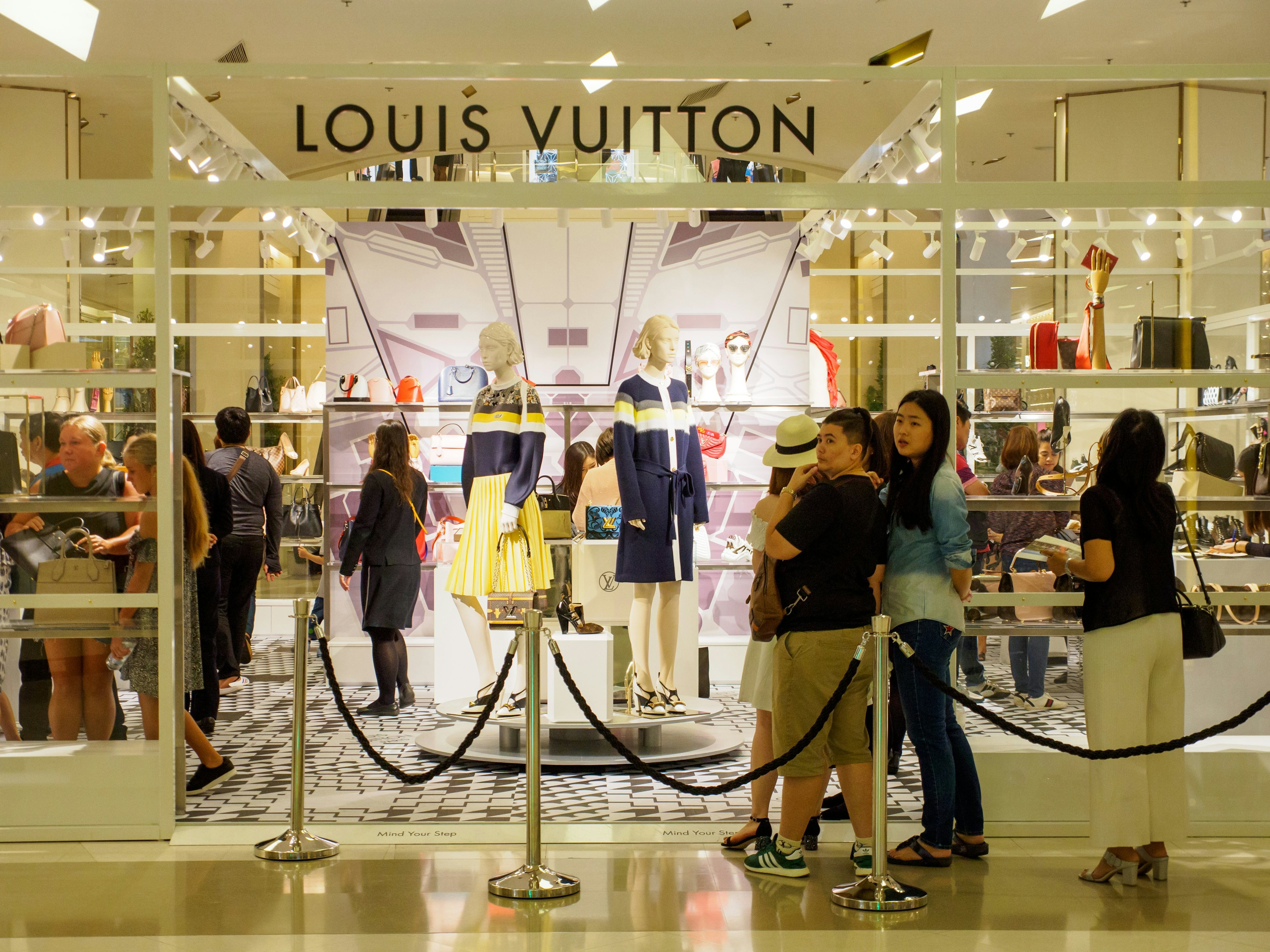 Chinese tourists queue up in front of a Louis Vuitton boutique at Siam Paragon department store in Bangkok, Thailand. Photo: Shutterstock