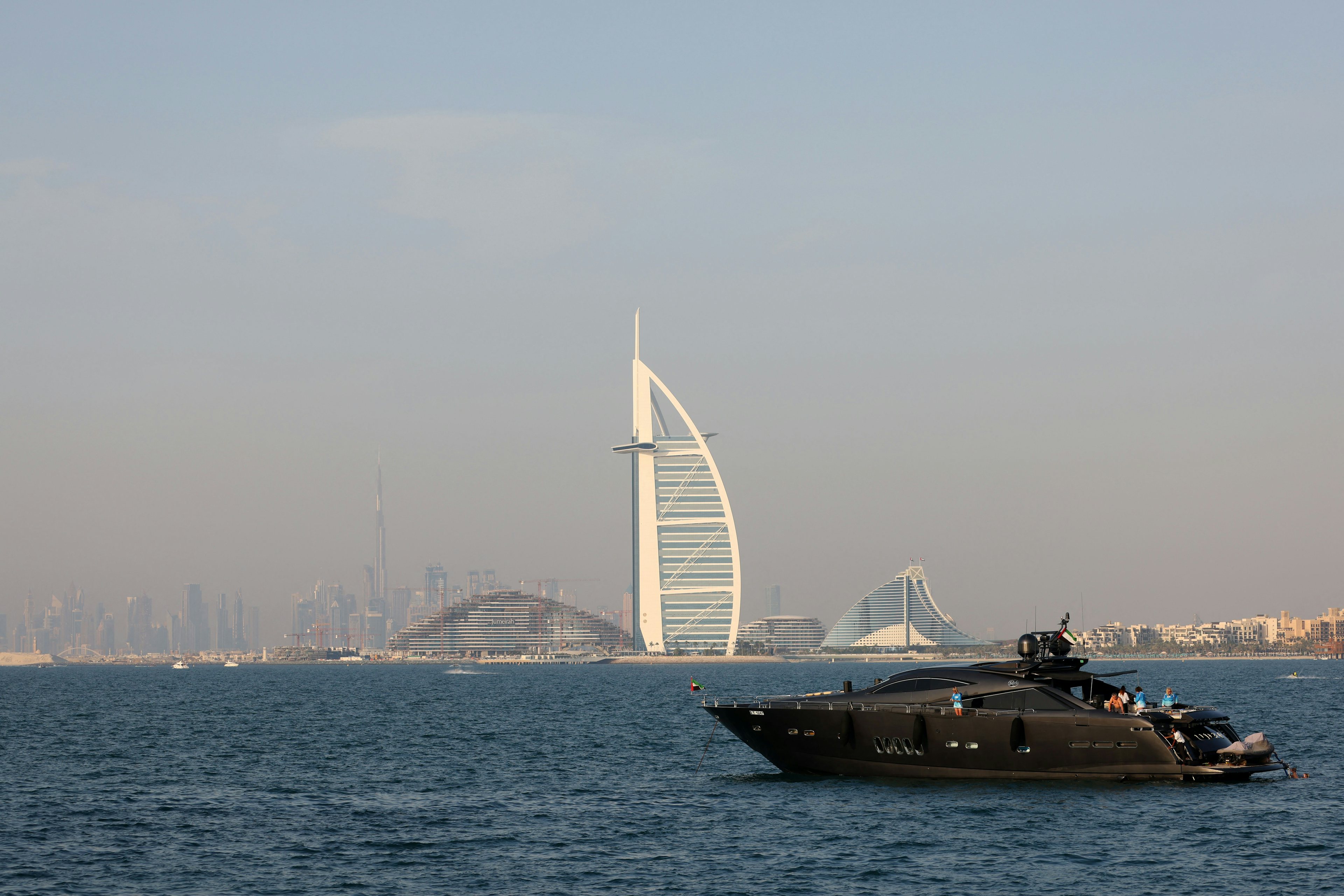 A yacht sails along the shore of the Emirate of Dubai on April 21, 2022. The UAE is the top destination for millionaires leaving China. Image: Getty Images