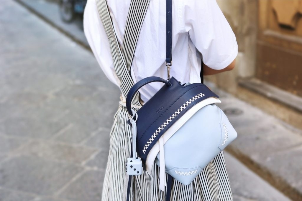 The Wave backpack features the signature Tod's leather stitching prominently alongside various shades of blue. Photo: Courtesy of Mr. Bags