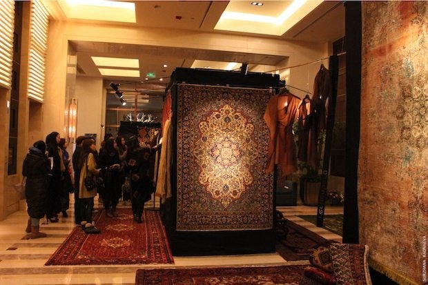 Guests view Zamani Collection's pop-up at the Four Seasons Beijing. (Surzhana Radnaeva)