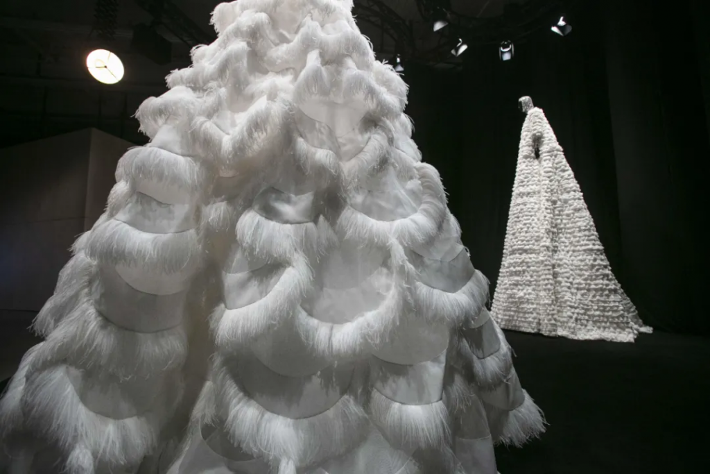 Three giant couture dresses in the exhibition. Photo: Valentino