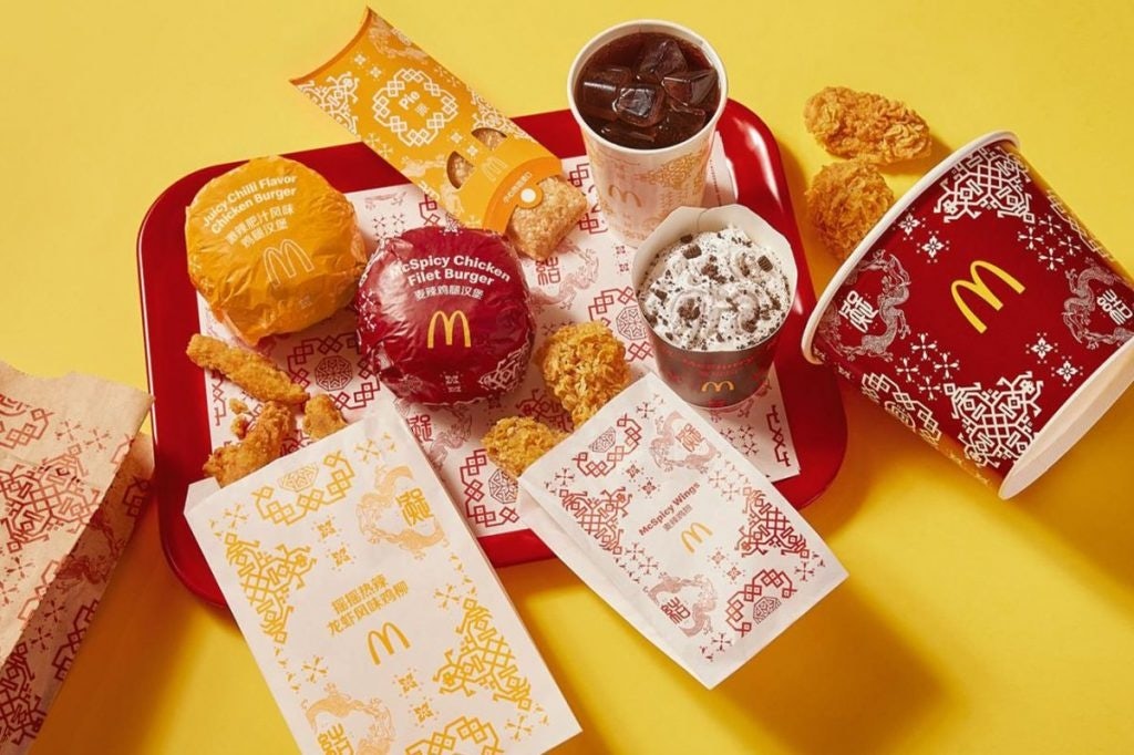McDonald's burger wrappers, tray mats, cups, and takeaway bags incorporate Clot’s iconic Silk Royale pattern. Photo: Clot