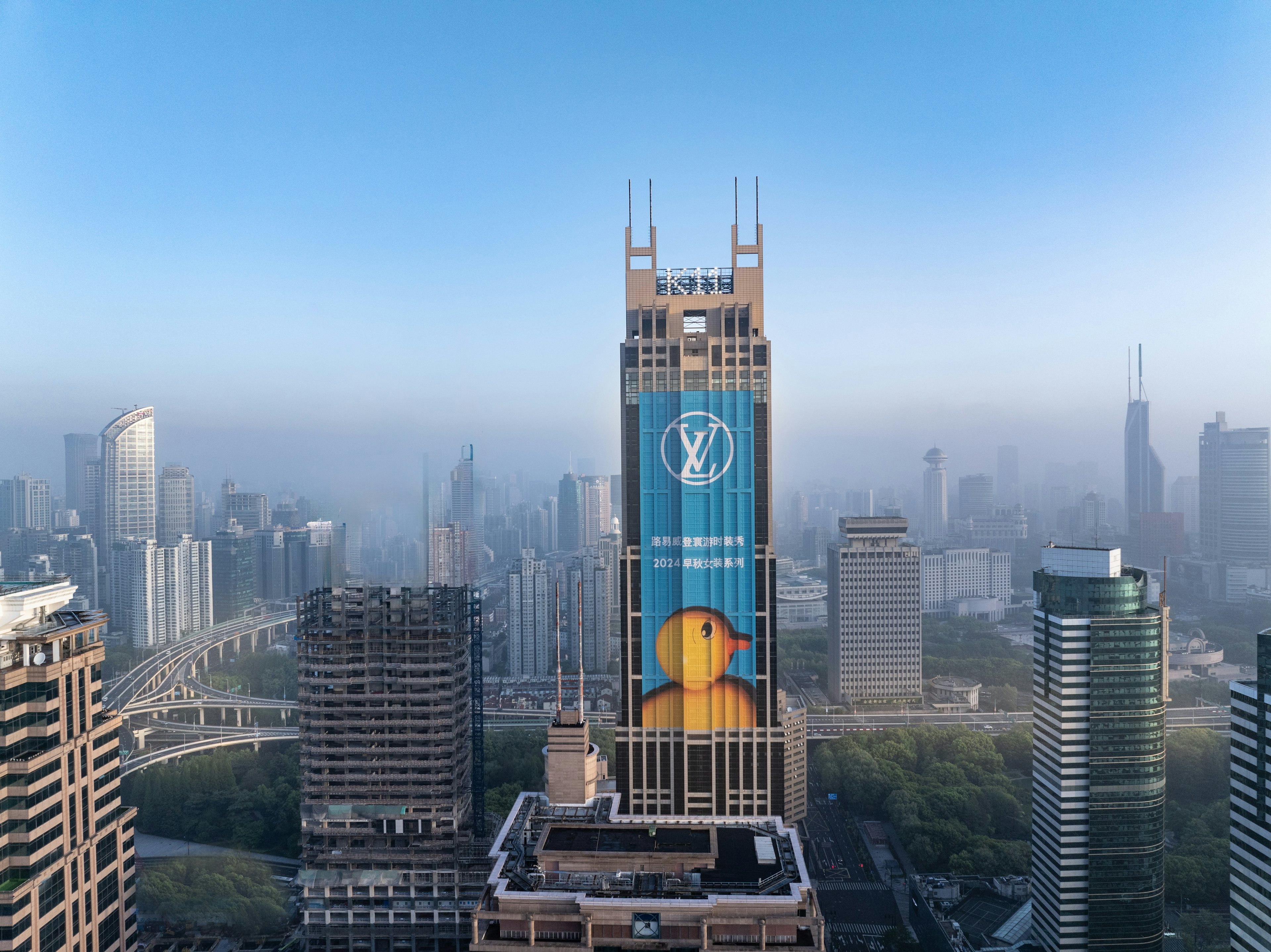 Louis Vuitton wraps the landmark K11 building in Shanghai with a duck print by Chinese artist Sun Yitan. Image: Louis Vuitton