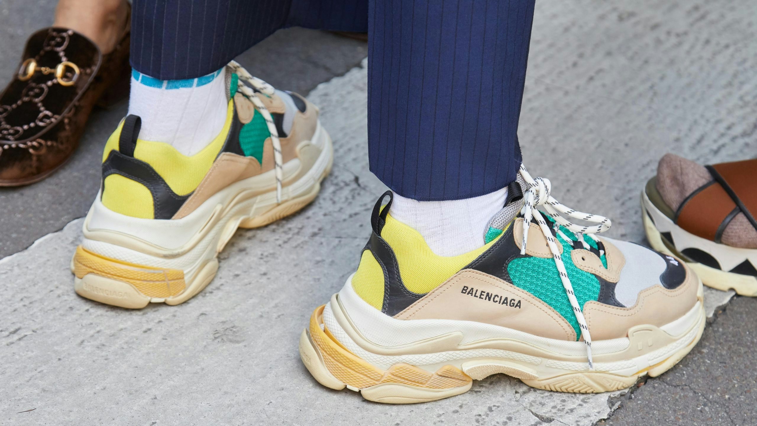 C-suite executives are ditching their dress shoes for luxury sneakers. What does this new social currency say about the future of fashion? Photo: Shutterstock