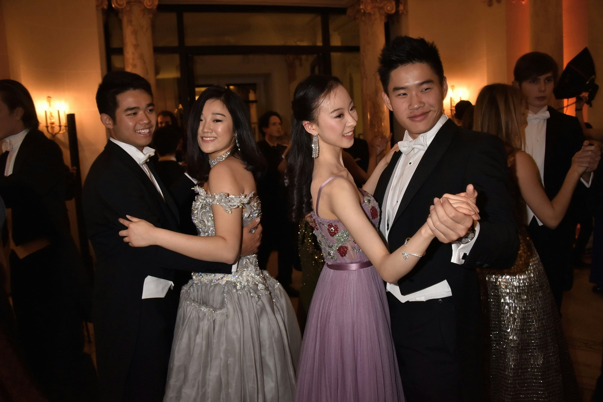 Donna Yuan (L) and Hang Yu (R) waltz with their partners at le Bal. (Jean Luce Huré/Courtesy Photo)