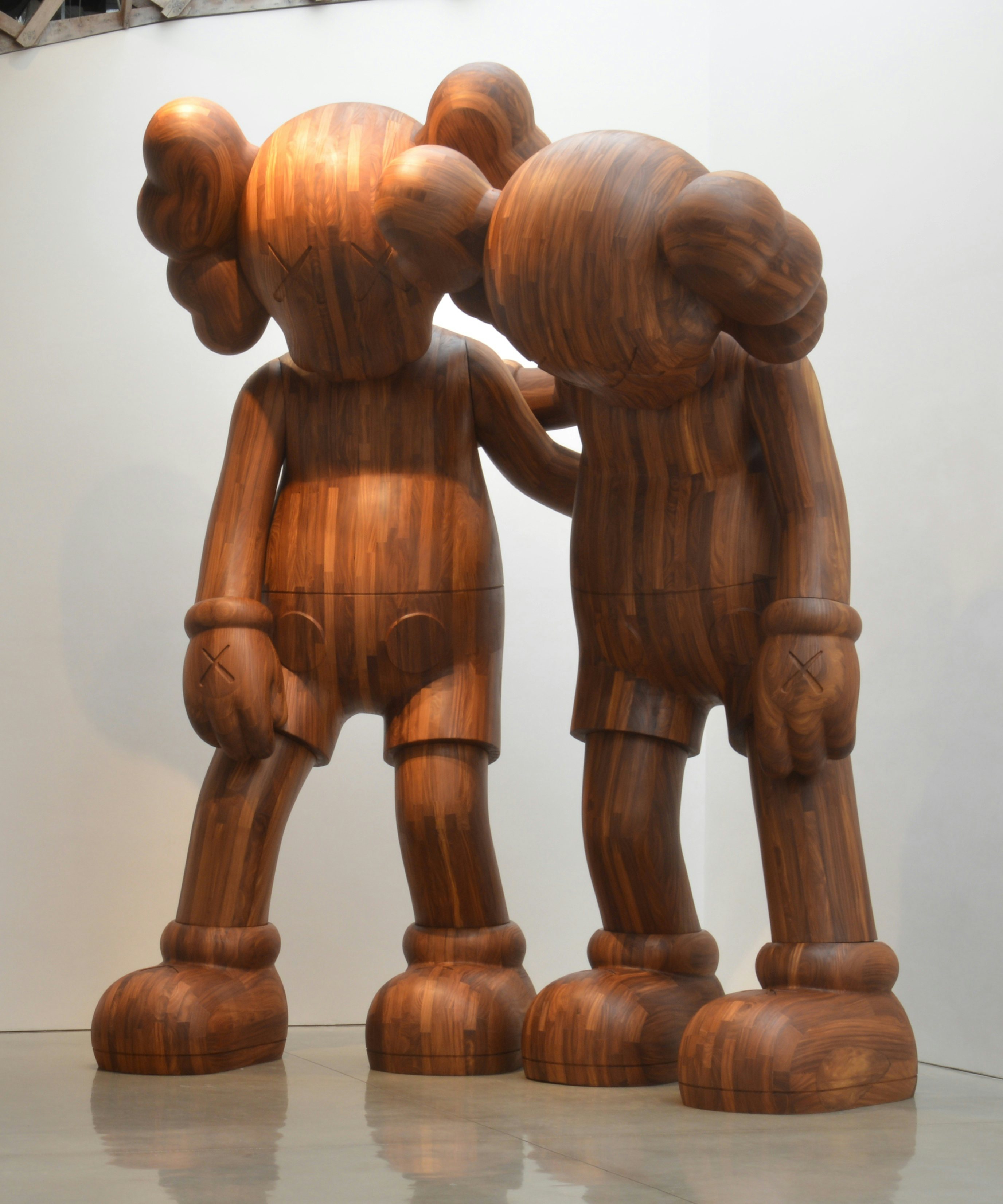 The KAWS "ALONG THE WAY" (2013) wooden sculpture from the collection of the artist will be on display at the Yuz exhibition. (Courtesy of Yuz Museum, collection of the artist)
