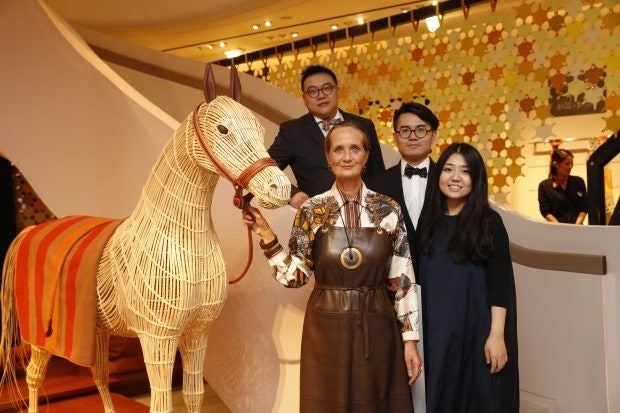 The Benwu Studio team poses in Hermès in Shanghai in November 2015 with Pascale Mussard, creative director of the Petit h collection. (Courtesy Photo)