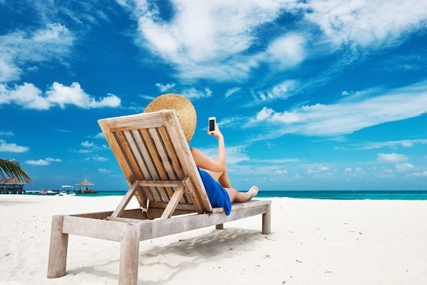 Expect Chinese travelers to utilize mobile devices even more in 2015. (Shutterstock)