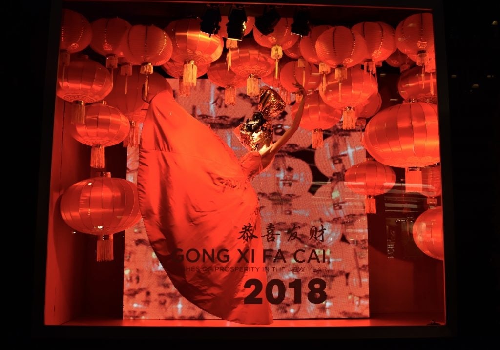 A window at Bloomingdale's reads "恭喜发财", which means "I wish you good fortune" in Chinese. A video in the background showcases traditional Chinese lanterns. Photo: Huixin Deng