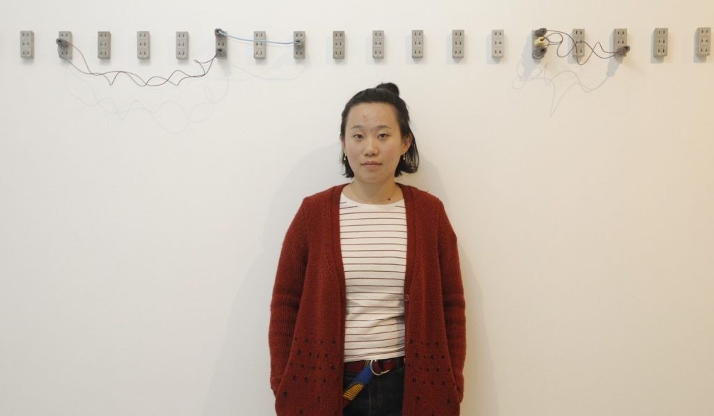 Chinese contemporary artist Zhang Ruyi and with her installation piece "Flow Away" at K11's Vivienne Westwood exhibition in Shanghai. (Courtesy Photo)