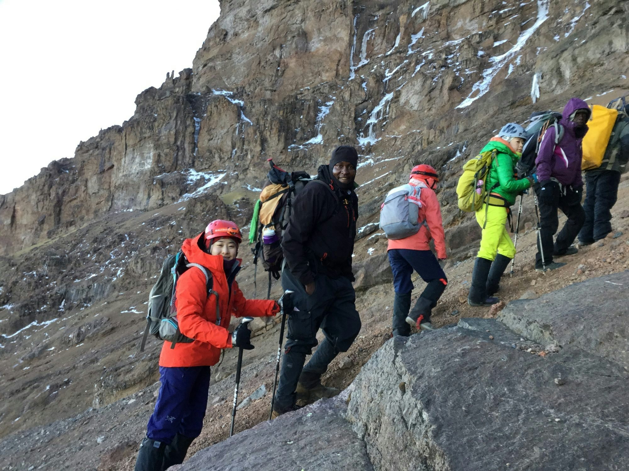 A group of Chinese tourists climb Mount Kilimanjaro as part of Beshan Wild China's bespoke tour. (Courtesy of 碧山 WildChina)