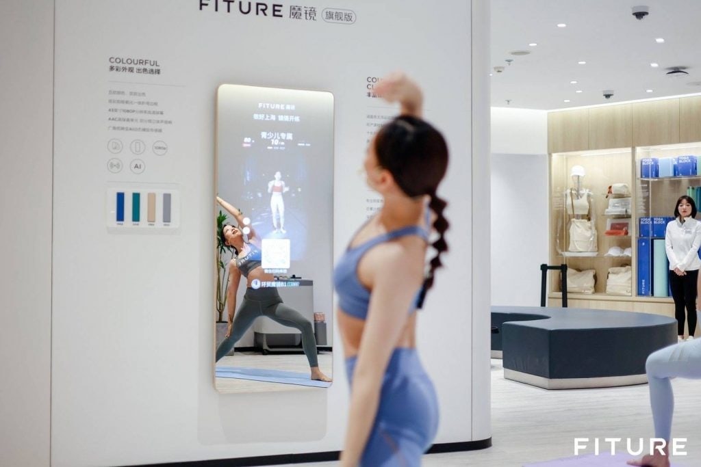 Chinese smart fitness company Fiture has developed a mirror-like workout screen that offers workout classes ranging from yoga to strength training. Photo: Fiture