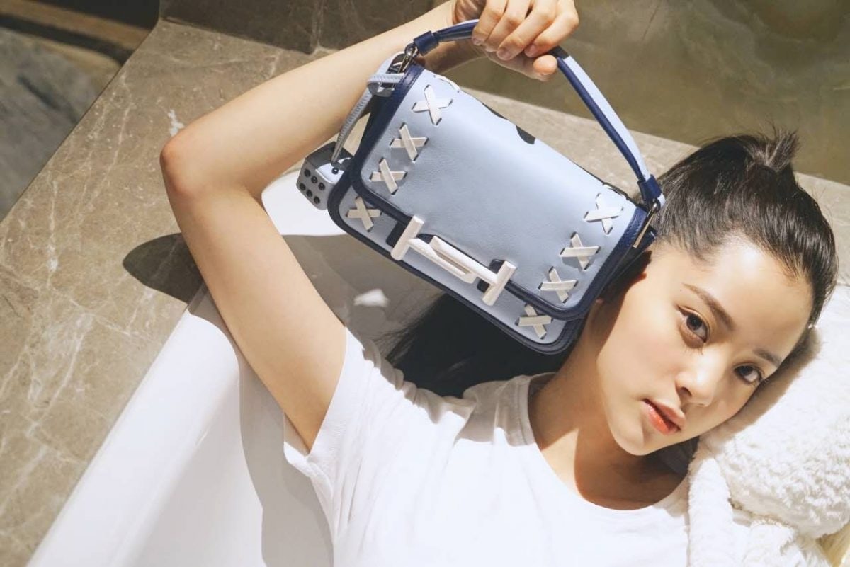 Rising star actress and musician Nana Ou-Yang shows off her Double T bag from Tod's x Mr. Bags capsule collection campaign. Photo: Courtesy of Mr. Bags