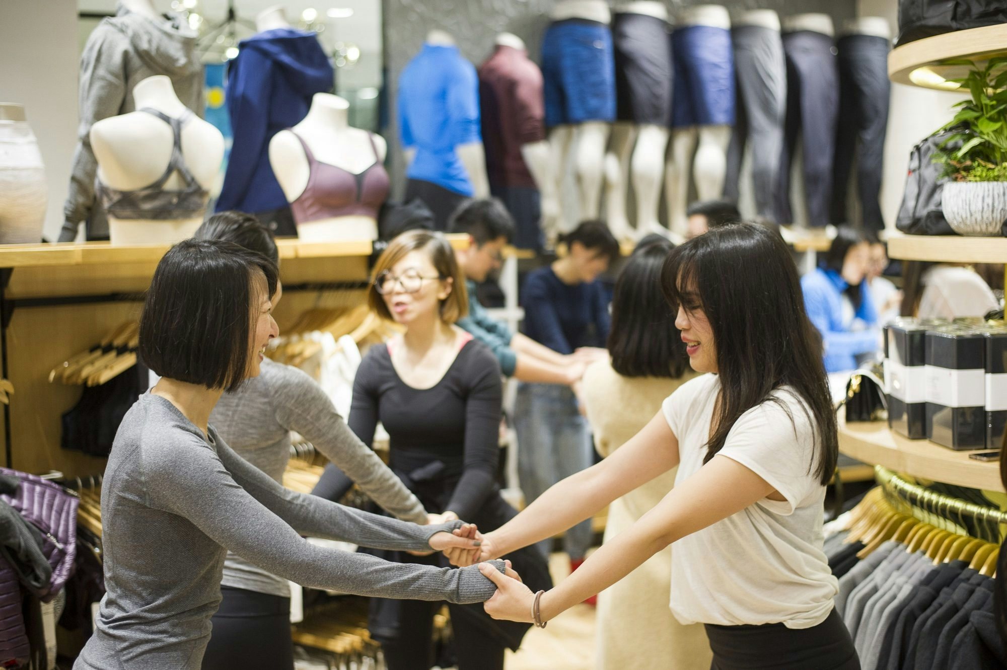 Shanghai's Lululemon fans participate in a group yoga and meditation activity at the brand's new store in IFC Mall. (Courtesy Photo)