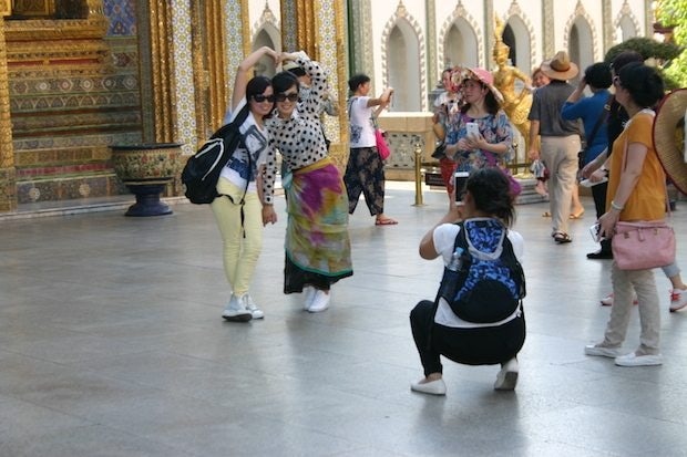 Chinese tourists at the Grand Palace in Bangkok, Thailand. (Jing Daily)