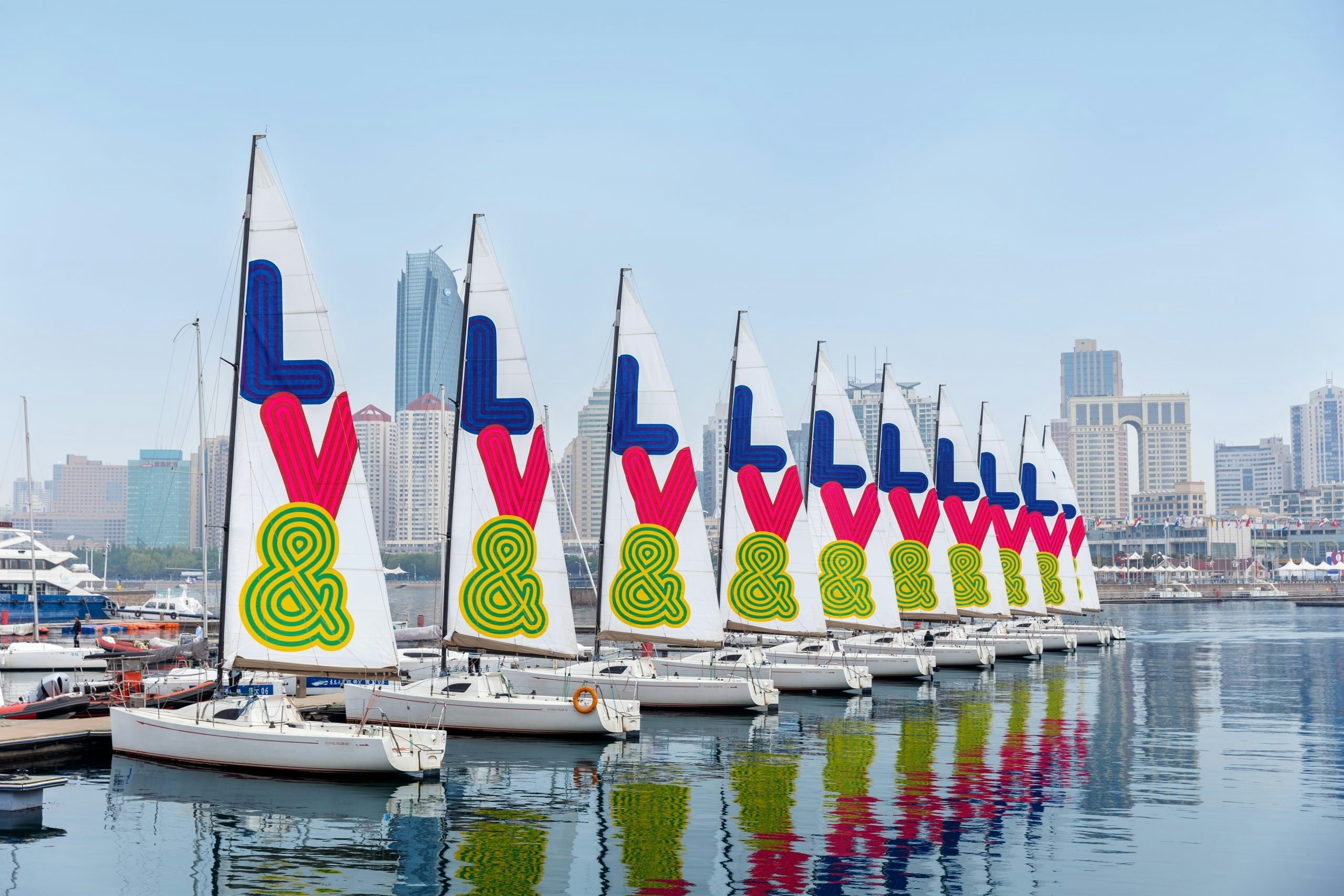 Louis Vuitton has mounted a variety of outdoor advertising on sailing boats to announce the opening of the Louis Vuitton& exhibition in Qingdao. Photo: Courtesy of Louis Vuitton