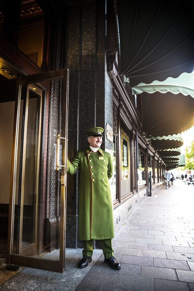 Harrods' doorman in the store's iconic green uniform. (Courtesy Photo)