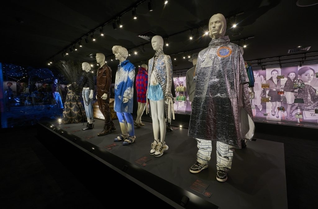 Visitors are invited to pass through a room devoted to the house’s ready-to-wear, featuring storied pieces from the brand’s four recent and current designers. Photo: Courtesy of Louis Vuitton