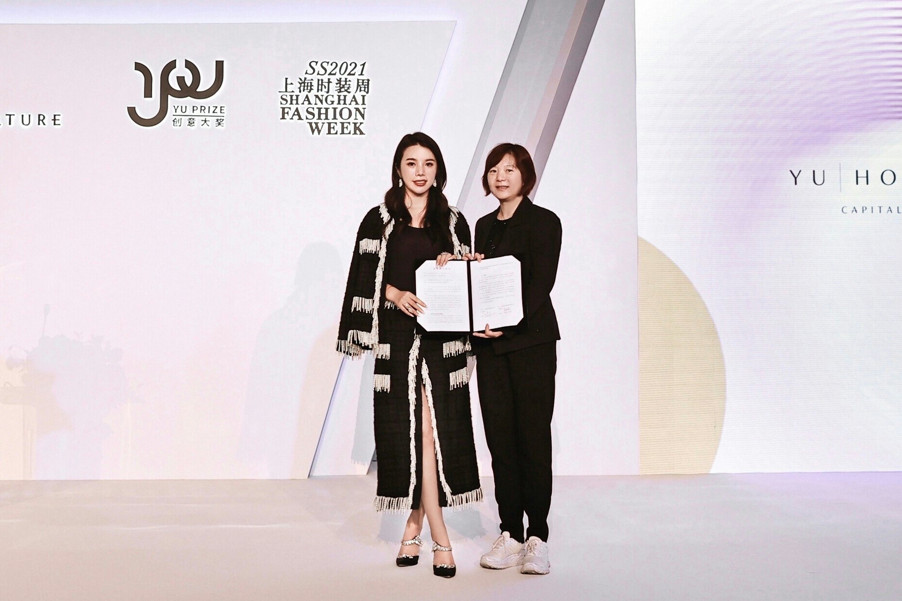 Wendy Yu (left), founder and CEO of Yu Holdings, and Lv Xiaolei (Madame Lu), the Vice Secretary General of Shanghai Fashion Week, at the announcement event. Photo: Yu Holdings 