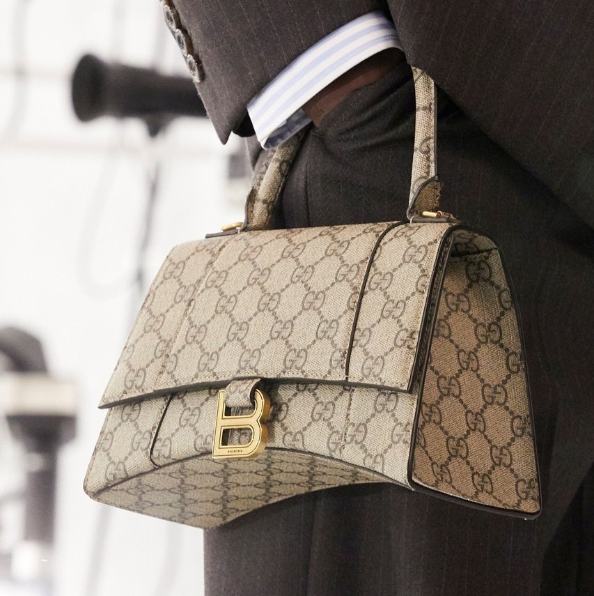 A Balenciaga bag, the Hourglass, comes in Gucci's classic GG Supreme canvas. Photo: Gucci