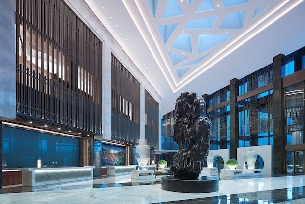 Zeng Fanzhi's 2.5-ton silver and bronze sculpture Le Shan in the lobby of the Nuo Hotel Beijing. (Courtesy Photo)