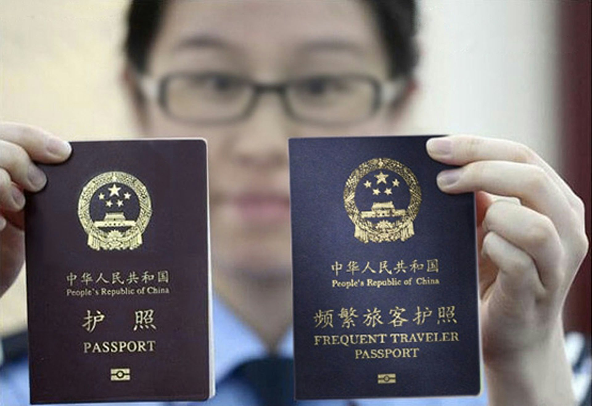The edited image that accompanied the story shows a new "frequent traveler passport" next to the ordinary Chinese passport.