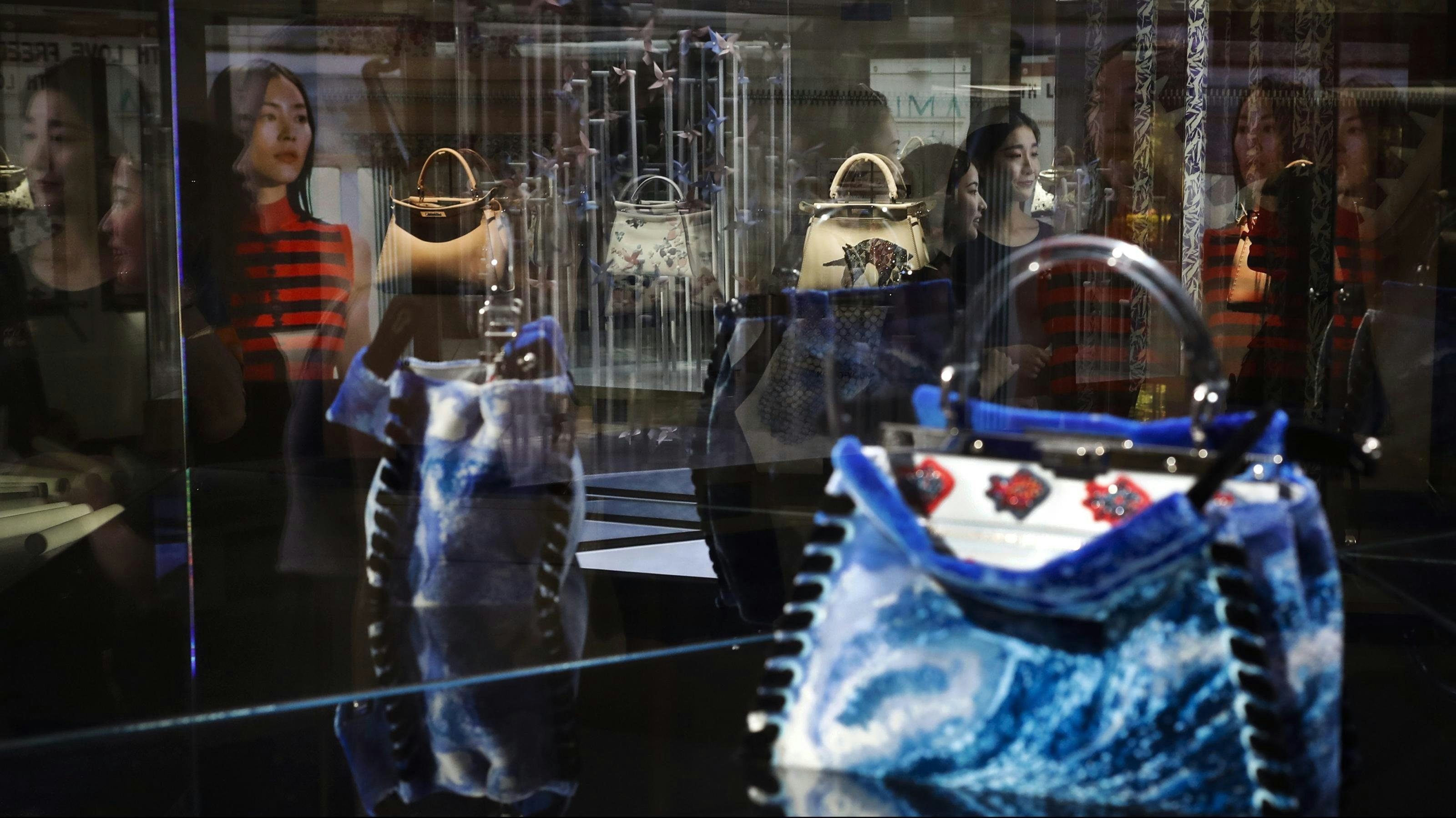 Luxury labels are increasingly launching digital flagships on Tmall.
Photo: AP/Andy Wong