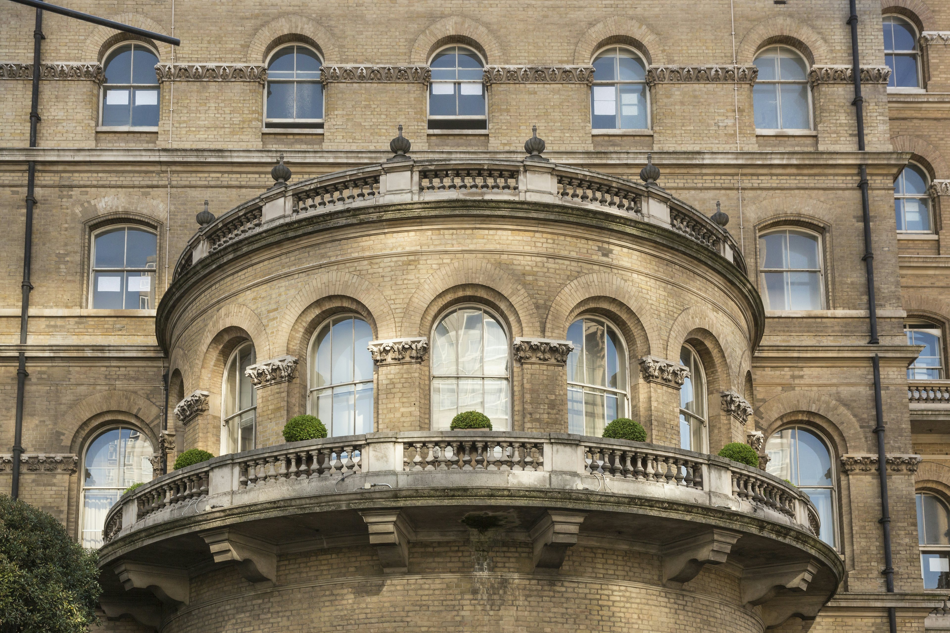 Detail of the facade of The Langham in London, the famous Victorian-style hotel which opened in 1865. Image via Shutterstock.