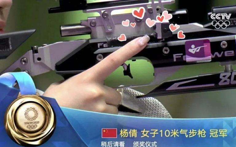 Sport shooter Yang Qian was spotted wearing glossy nails during a race. Photo: CCTV screenshot