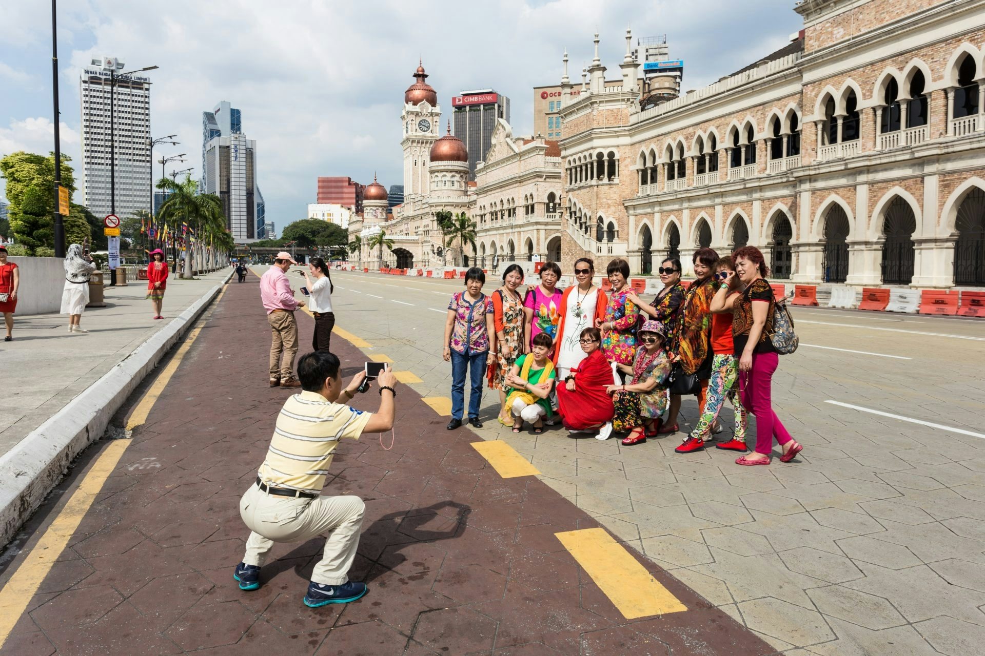 Chinese tourists pose for a photo in Kuala Lumpur, Malaysia. Tencent's latest move is designed to encourage more local businesses to adopt WeChat Pay and facilitate Chinese tourism. Photo: Shutterstock