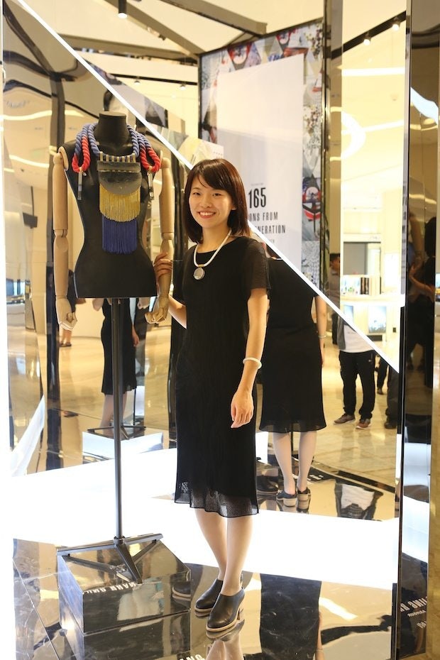Ejing Zhang with her artwork, "Armour." (Courtesy Photo)
