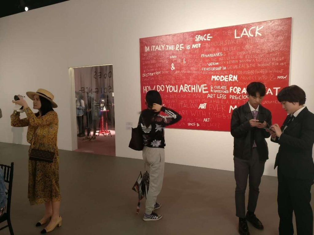 Chinese youth brought their style and cameras to Gucci's Beijing exhibition, which is on until April 9. (Photo by Jessica Rapp)