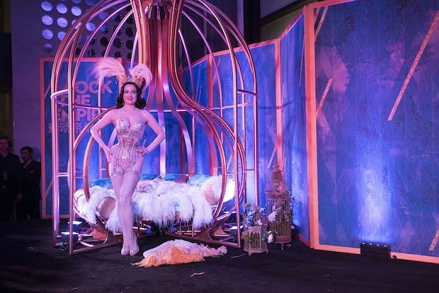 Dita Von Teese in front of a Chinese-style birdcage for W's promotion of its Beijing opening. (Courtesy Photo)