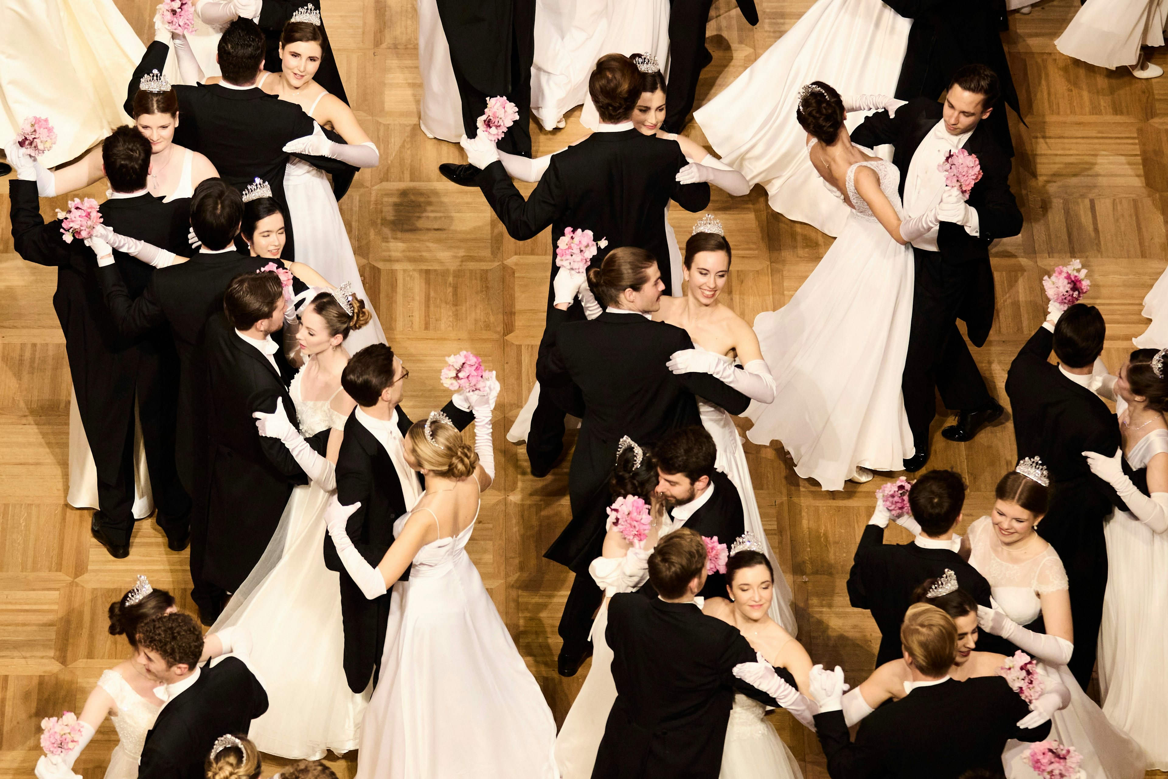 Debutantes in their Swarovski tiaras dancing with their dates at the 2024 Vienna Opera Ball. Image: Swarovski