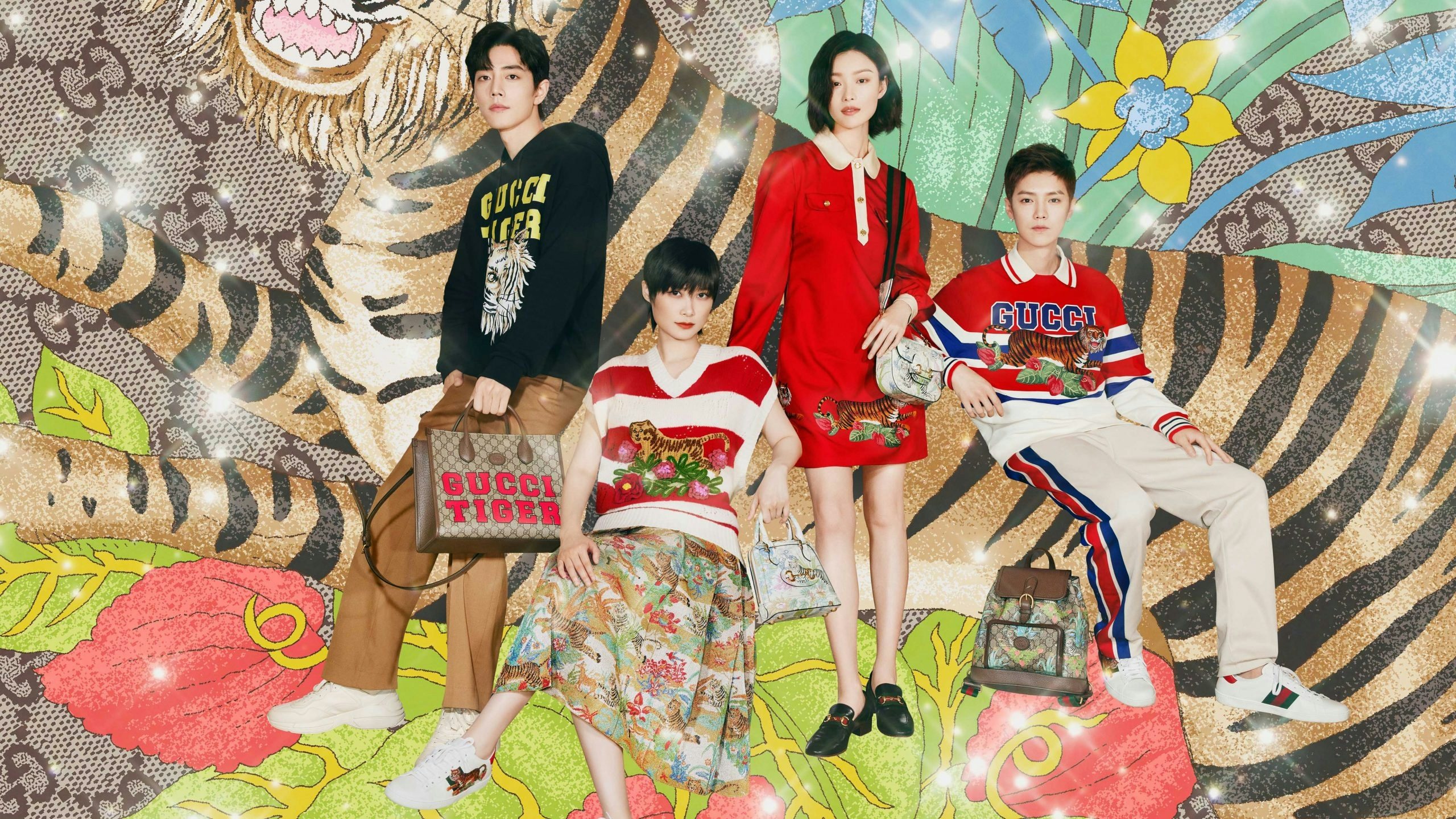Against an illustrated background of tigers and greenery, Gucci created a family reunion scene with global brand ambassadors, including Chris Lee, Ni Ni, Lu Han, and Xiao Zhan. Photo: Courtesy of Gucci