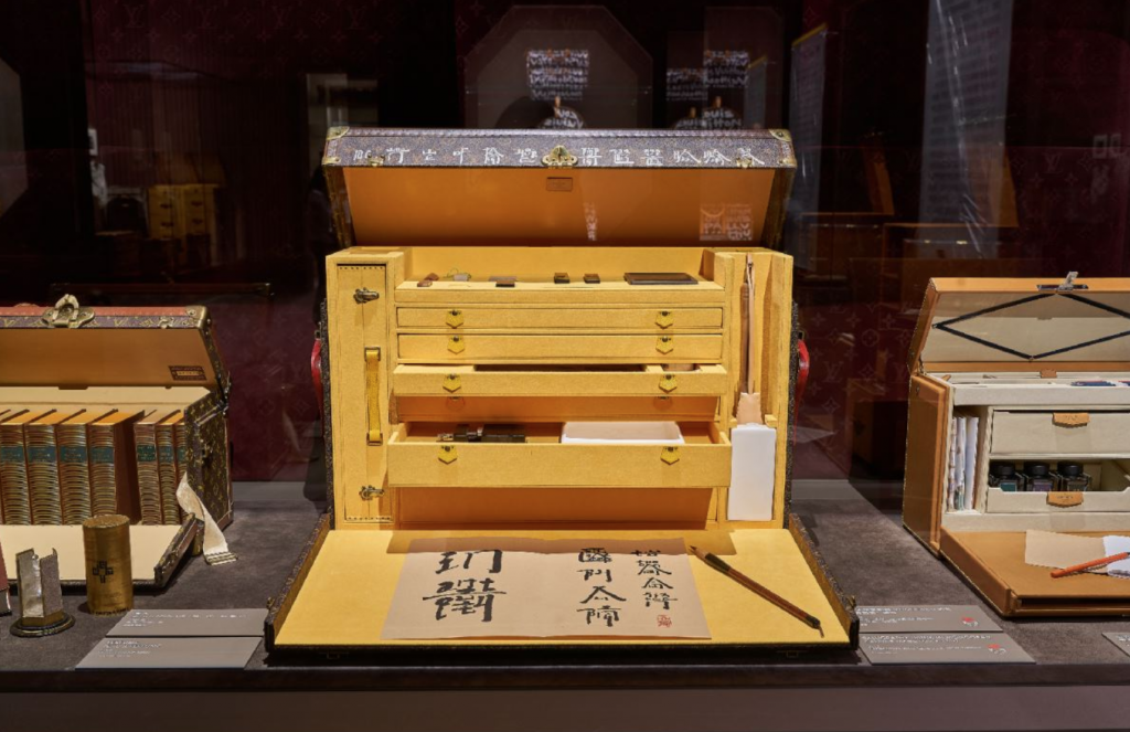 The trunk, which took two years to make, features the traditional Louis Vuitton monogram pattern along with Xu Bing’s signature hybrid English-Chinese script to form text inspired by a poem by the modern Chinese poet Zhai Yongming, and inside are traditional Chinese ink brushes. Courtesy image.
