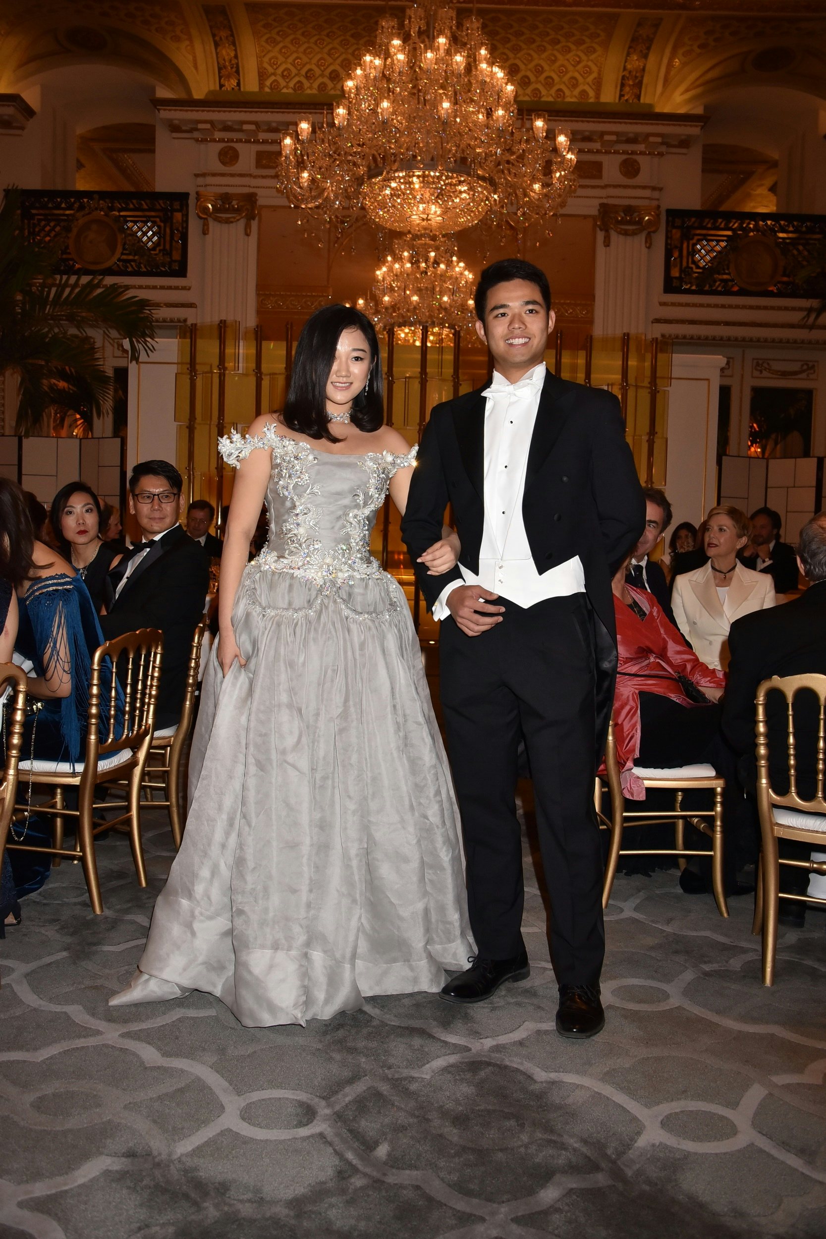 Donna Yuan in a Guo Pei gown and Payal New York jewelry with her cavalier Marco Lam. (Jean Luce Huré/Courtesy Photo)