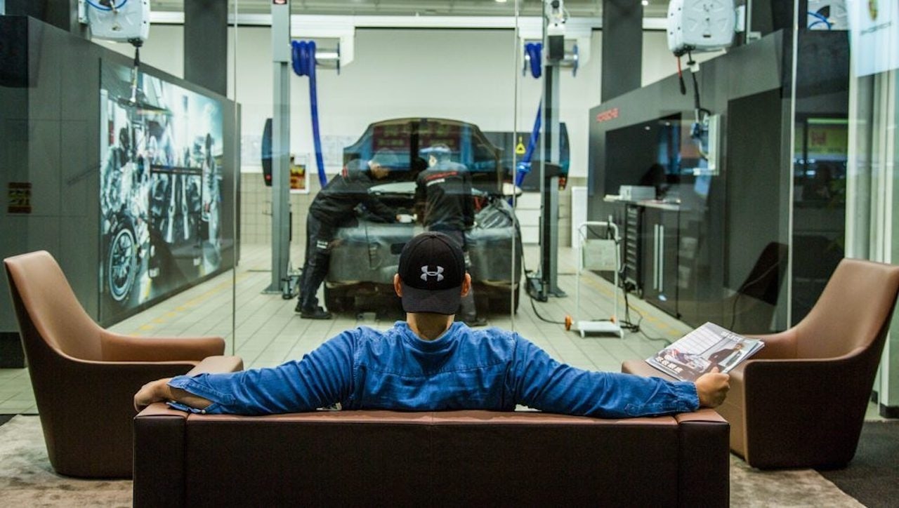 Porsche drivers can watch their cars being serviced at a new service center in Shenzhen. Photo: Jebsen Motors